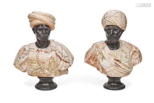 A pair of carved marble and onyx busts