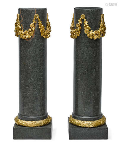 20th century A pair of Neoclassical style gilt bronze mounted granite pedestals