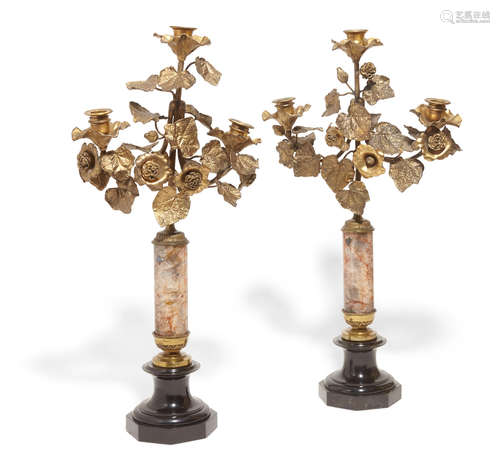 Composed of antique elements A pair of Continental Blue John, black slate and gilt brass three light candelabra