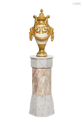 A Neoclassical style gilt bronze mounted white marble covered urn on octagonal pedestal