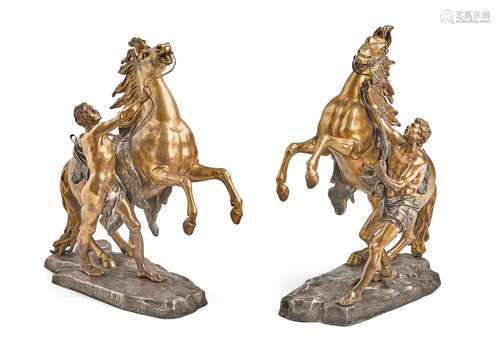 Late 19th century A pair of silvered and gilt bronze groups: cheval de Marlyafter Guillaume Coustou