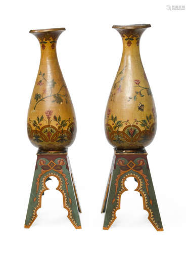 Fourth quarter 19th century A pair of Aesthetic Movement polychrome decorated terracotta floor vases with custom wood stands