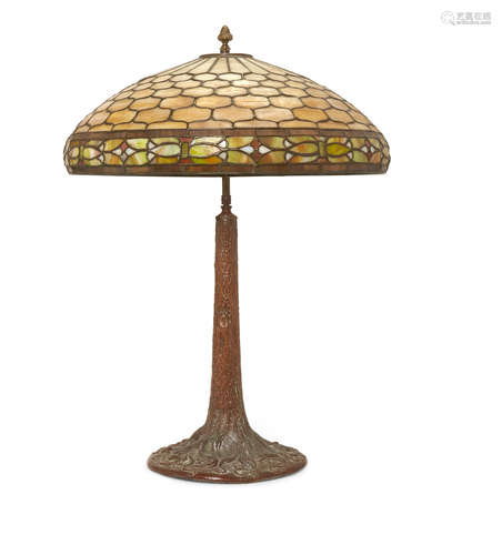 Early 20th century A Duffner and Kimberley leaded glass lamp shade and a patinated metal base