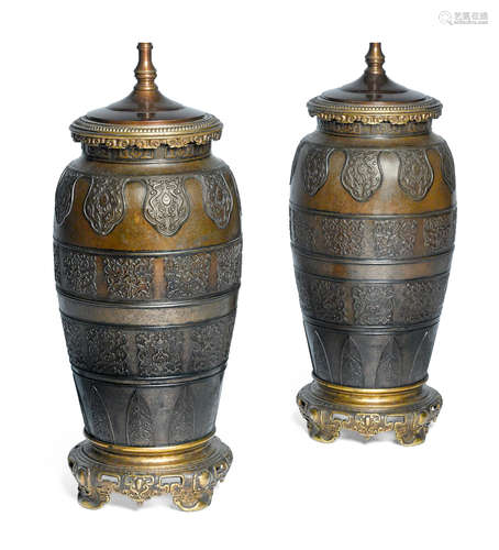 A pair of French patinated bronze vases in the Chinoisere style mounted as lamps