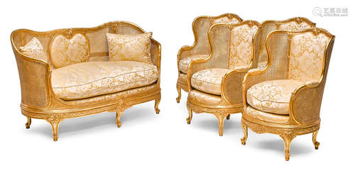 20th century A Louis XV style giltwood and caned five piece salon suite