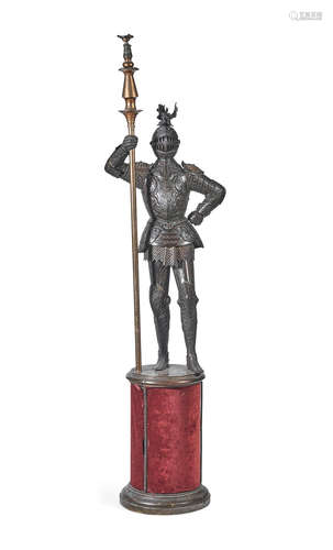 A patinated bronze figure of an armoured knight