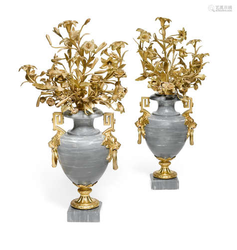 A pair of Louis XVI style gilt bronze mounted gray marble rose and lily bouquet urn form candelabra