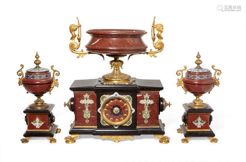 Fourth quarter 19th century A French Aesthetic Movement gilt bronze, rouge marble, black slate and champelvé enamel three piece clock garniture