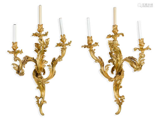 A pair of Louis XV style gilt bronze three light bras de lumière