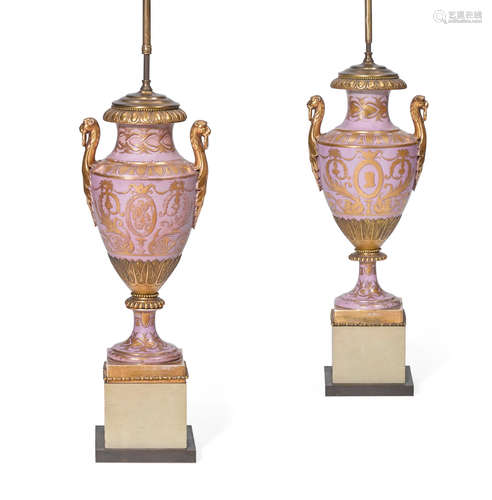 Early 20th century A pair of Sèvres style porcelain gilt bronze mounted two handled vases in the Empire taste