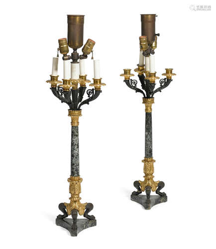 Second quarter 19th century A pair of Louis Philippe gilt patinated bronze and verde antico marble five light candelabra