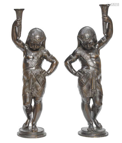 In the manner of the Val d'Osne foundry A pair of patinated cast iron Egyptian Revival torchères