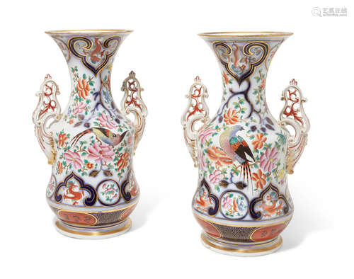 Third quarter 19th century A pair of Continental porcelain two handled vases painted in a 'Japan' pattern