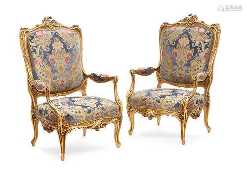 Second half 19th century An Imposing pair of French Rococo style velvet upholstered giltwood armchairs