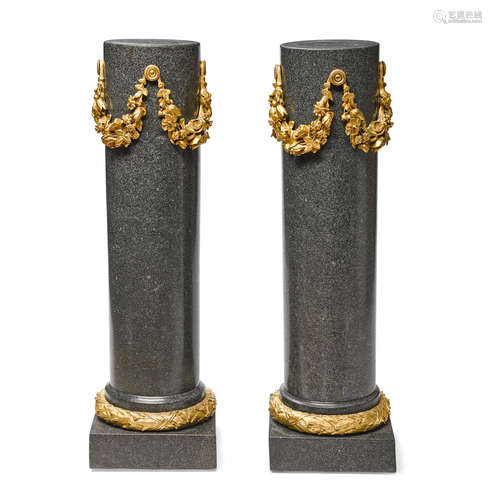 20th century A pair of Neoclassical style gilt bronze mounted granite pedestals