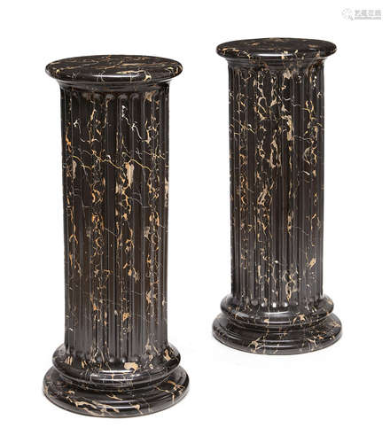 A pair of faux Portor marble pedestals