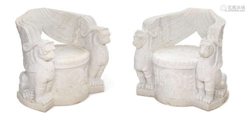 A pair of Empire style carved marble garden seats