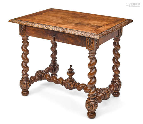 19th century A Continental Baroque style carved walnut table