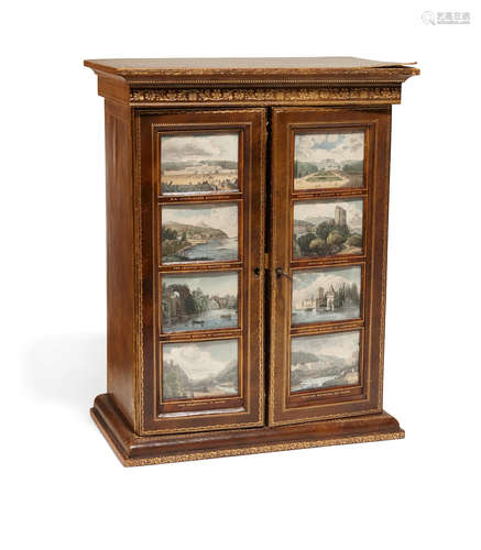 A Continental gilt tooled leather and print inset table cabinet