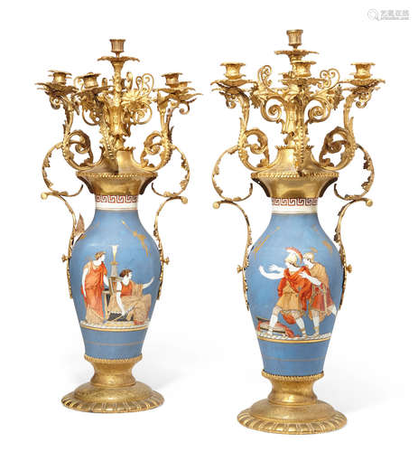 Late 19th century A pair of Continental gilt bronze mounted porcelain seven light candelabra