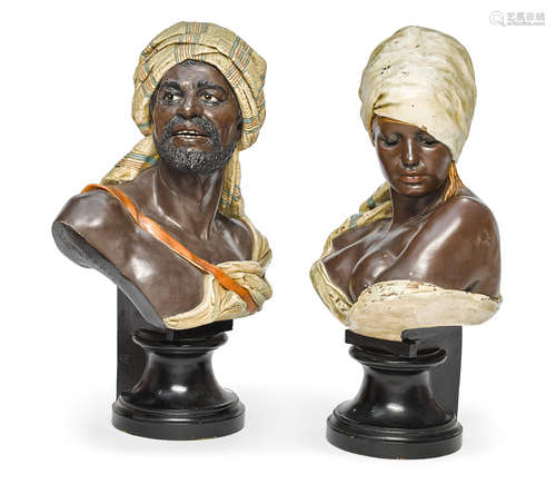 Early 20th century A pair of polychrome decorated terracotta busts of a man and a woman After Wilhelm Giesecke (1854-1917) and Rudolf Thiele (1856-1930)