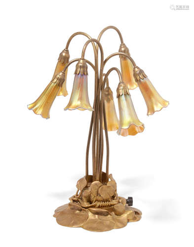 Early 20th century A Tiffany Studios gilt bronze Seven Light Lily lamp