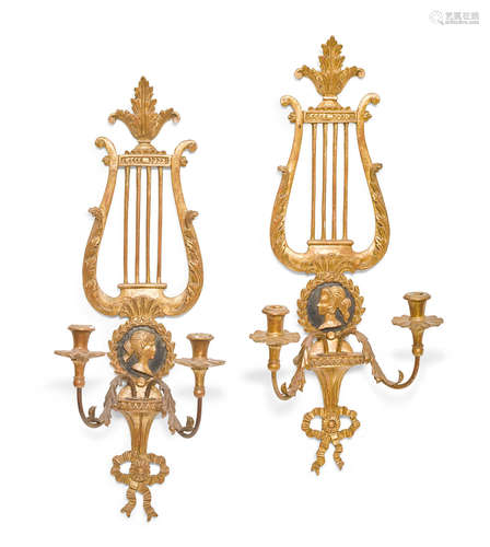 A pair of Neoclassical style parcel ebonized giltwood and tôle two light wall scones