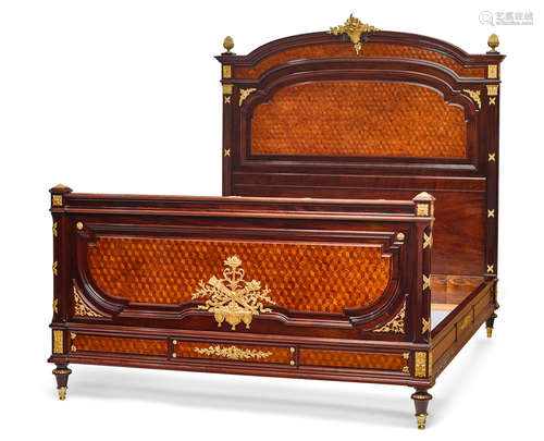 20th century A Louis XVI style gilt bronze mounted parquetry inlaid mahogany bed