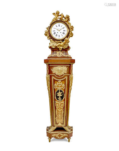 By Garnier, Paris; after a model by Jean-Henri RiesenerLate 19th century A Louis XVI style gilt bronze mounted inlaid mahogany régulateur de parquet