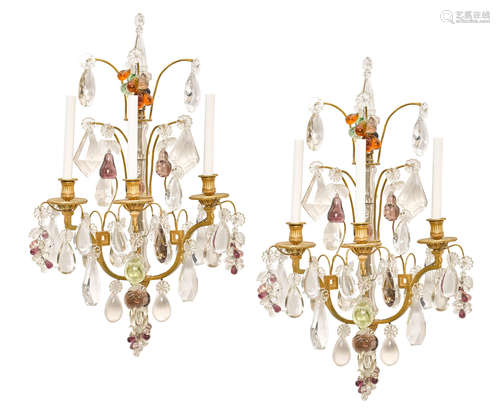 A pair of Louis XV style gilt bronze clear and colored glass three light bras de lumière