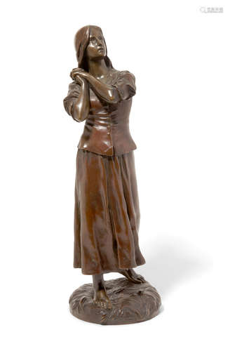 Circa 1900 A French patinated bronze figure of Joan of Arc after a model by François-Raoul Larche (French, 1860-1912)