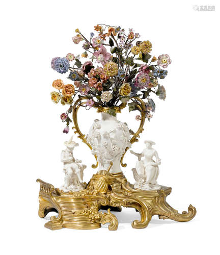 A Louis XV style porcelain and gilt bronze floral and figural centerpiece