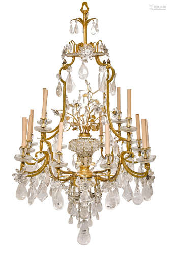 A French gilt bronze and rock crystal sixteen light chandelier