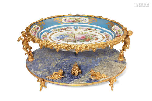 A Continental gilt bronze mounted Sèvres style porcelain and lapis two tier centerpiece