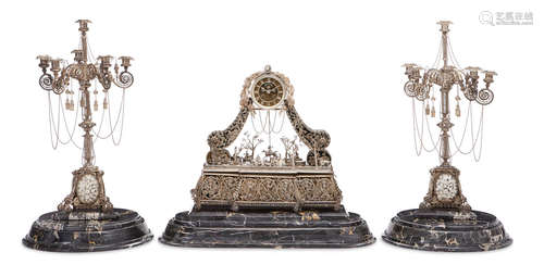 First half 20th century An unusual silver filigree, velvet, and gemset three piece clock garniture