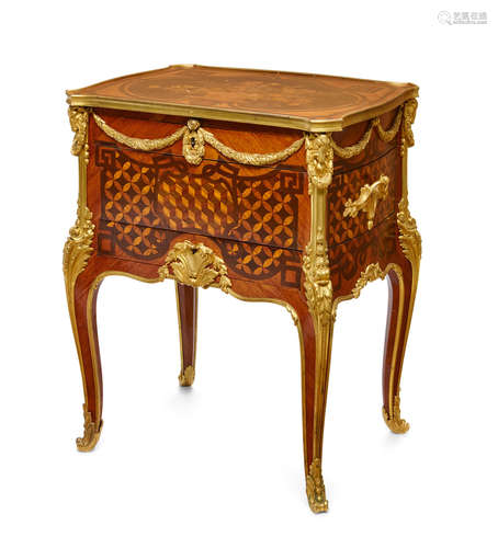 After the model by Jean-François OebenLate 19th century A Louis XV/XVI Transitional style gilt bronze mounted marquetry and parquetry inlaid tulipwood Lady's writing and dressing table