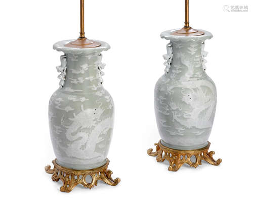 19th century A pair of Chinese pâte-sur-pâte celadon porcelain two handled vases