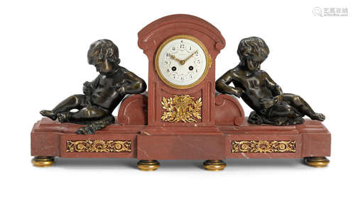 Early 20th century A French patinated and gilt bronze mounted rouge marble clockretailed by Tiffany and Co.