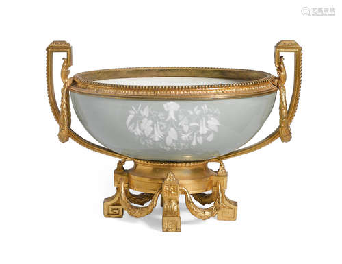 Fourth quarter 19th century A French pâte-sur-pâte porcelain and gilt bronze mounted two handled centerpiece bowl