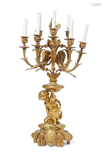 Late 19th century A French gilt bronze seven light figural candelabrum