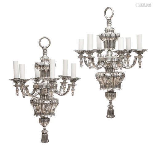 Early 20th century A pair of silvered metal six light chandeliers attributed to E.F. Caldwell & Co., New York, NY