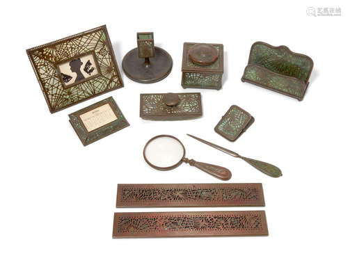 Early 20th century A Tiffany Studios Favrile glass and patinated bronze Ten piece desk set in the Pine Needle Pattern