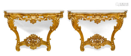 20th century A pair of Louis XV style carved giltwood marble top console tables