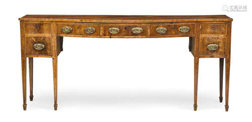 Fourth quarter 18th century A George III inlaid mahogany sideboard of serpentine outline