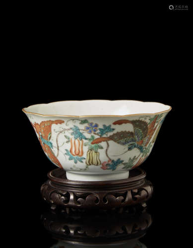 A small porcelain bowl with apocryphal Jiaqing mark to the base, wood base (defects)China, late 19th