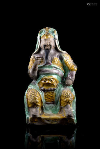 A 'three-colours' enamel biscuit model of the warrior Zhenwu (defects)China, Qing dynasty, Kangxi