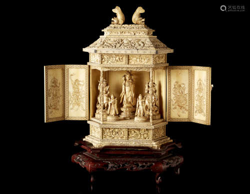 An ivory shrine with sculptures of Kannon, guardians and attendants, marked to the base, with wood