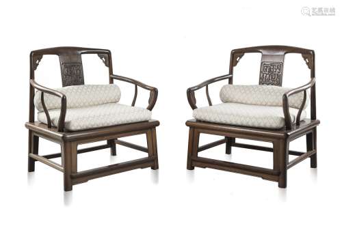 A pair of rosewood, liao hua li, arm chairs with carved dragon panel on the splat (slight defects)