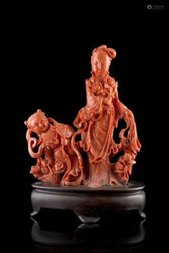 A red coral carving of a lady and a boy, with wood baseChina, 20th century(h. 16.5 cm.; net weight