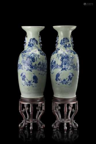A pair of celadon-ground baluster vases with twin lion handles and blue and white decorationChina,